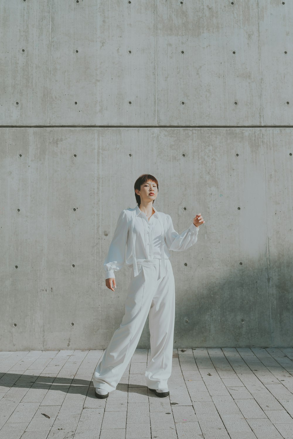 a man in white suit