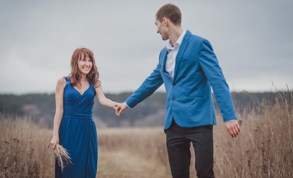 a man and woman holding hands