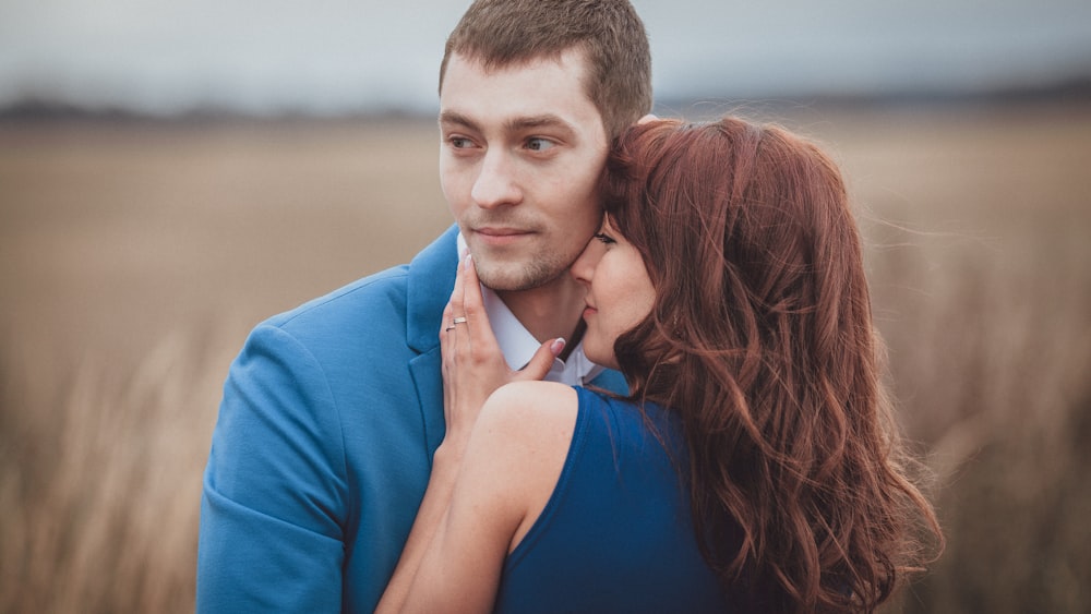 a man and woman kissing