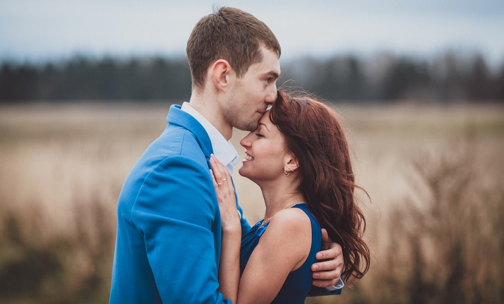 a man and woman kissing