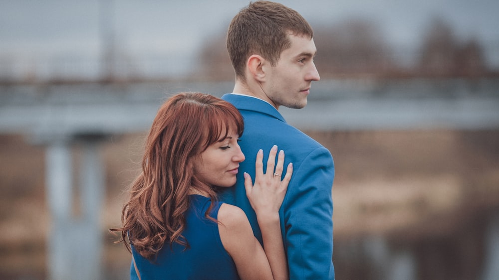 a man and woman holding hands