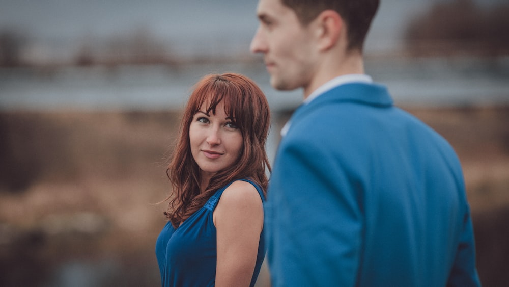 a man and woman looking at each other