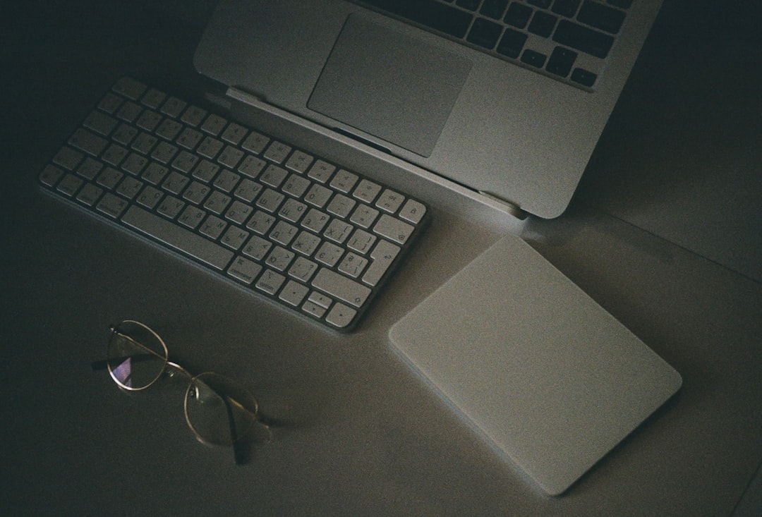 a laptop and a pair of glasses, Work space
