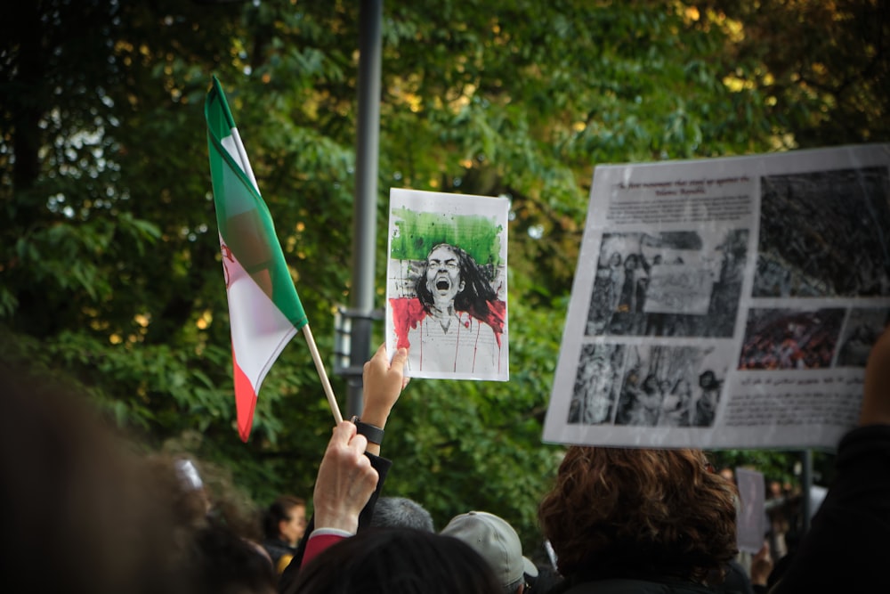 a group of people holding flags