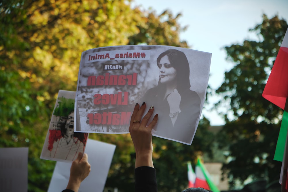 a person holding a sign