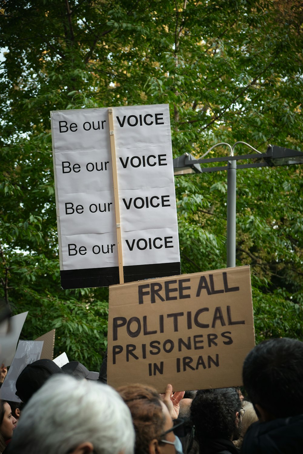 a group of people holding signs