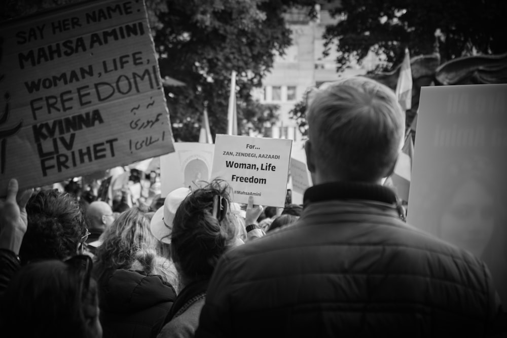 a group of people holding signs