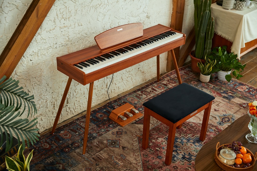 a piano with a stool and plants