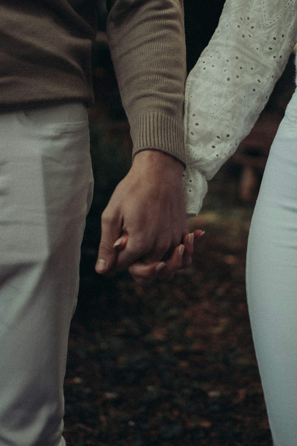 a close-up of hands holding a small hand