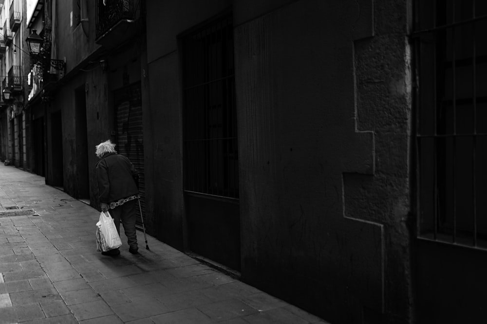 a person walking down a sidewalk