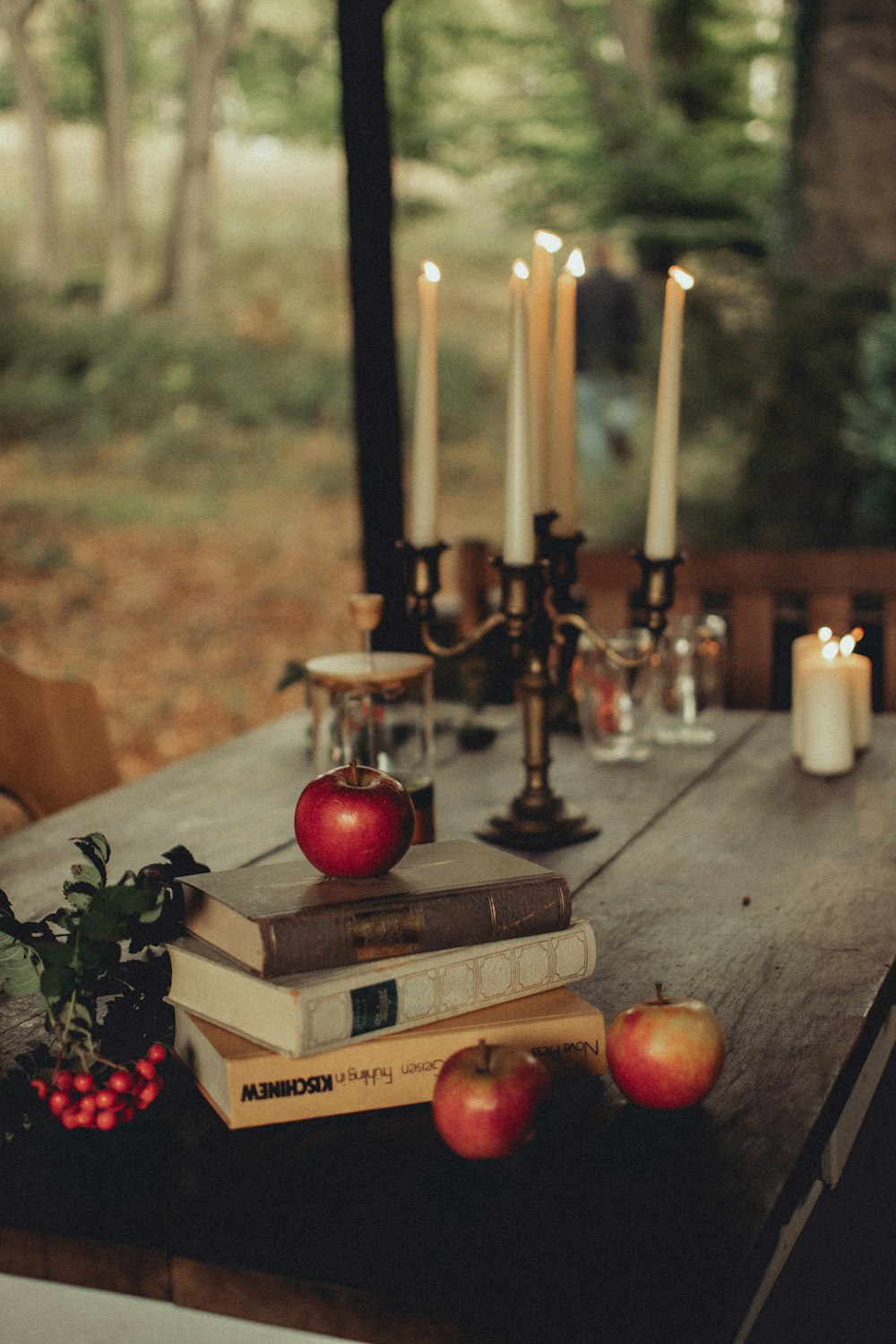 a table with candles and fruit