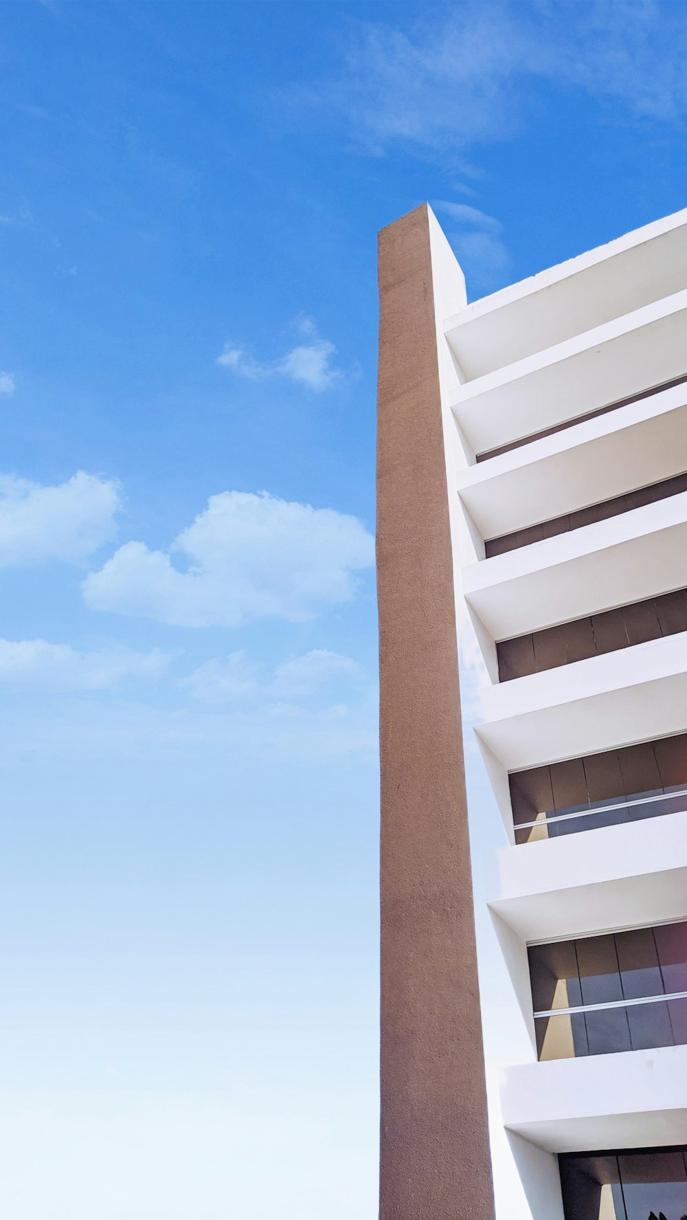 a tall building with a blue sky