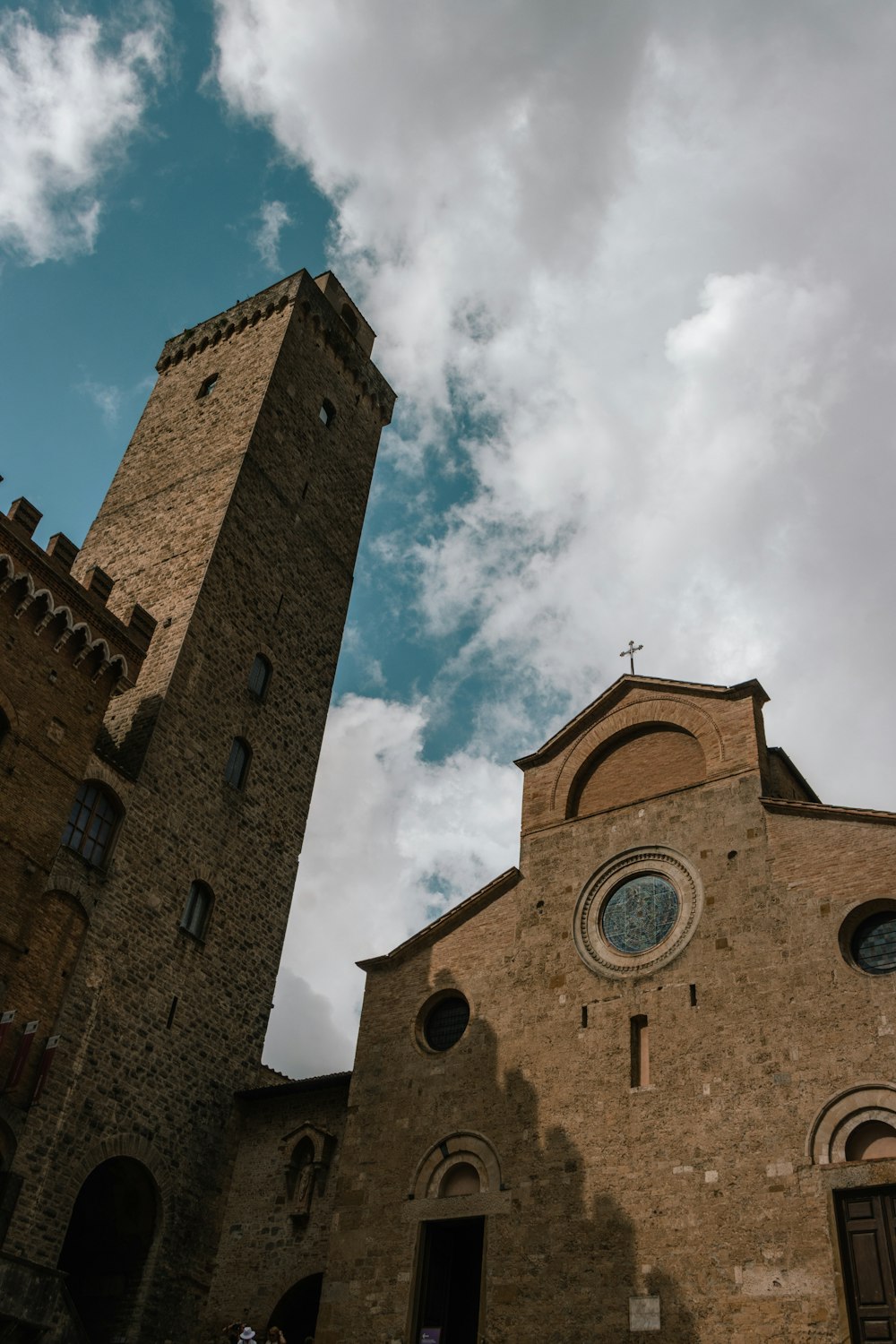 a large brick building with a tall tower