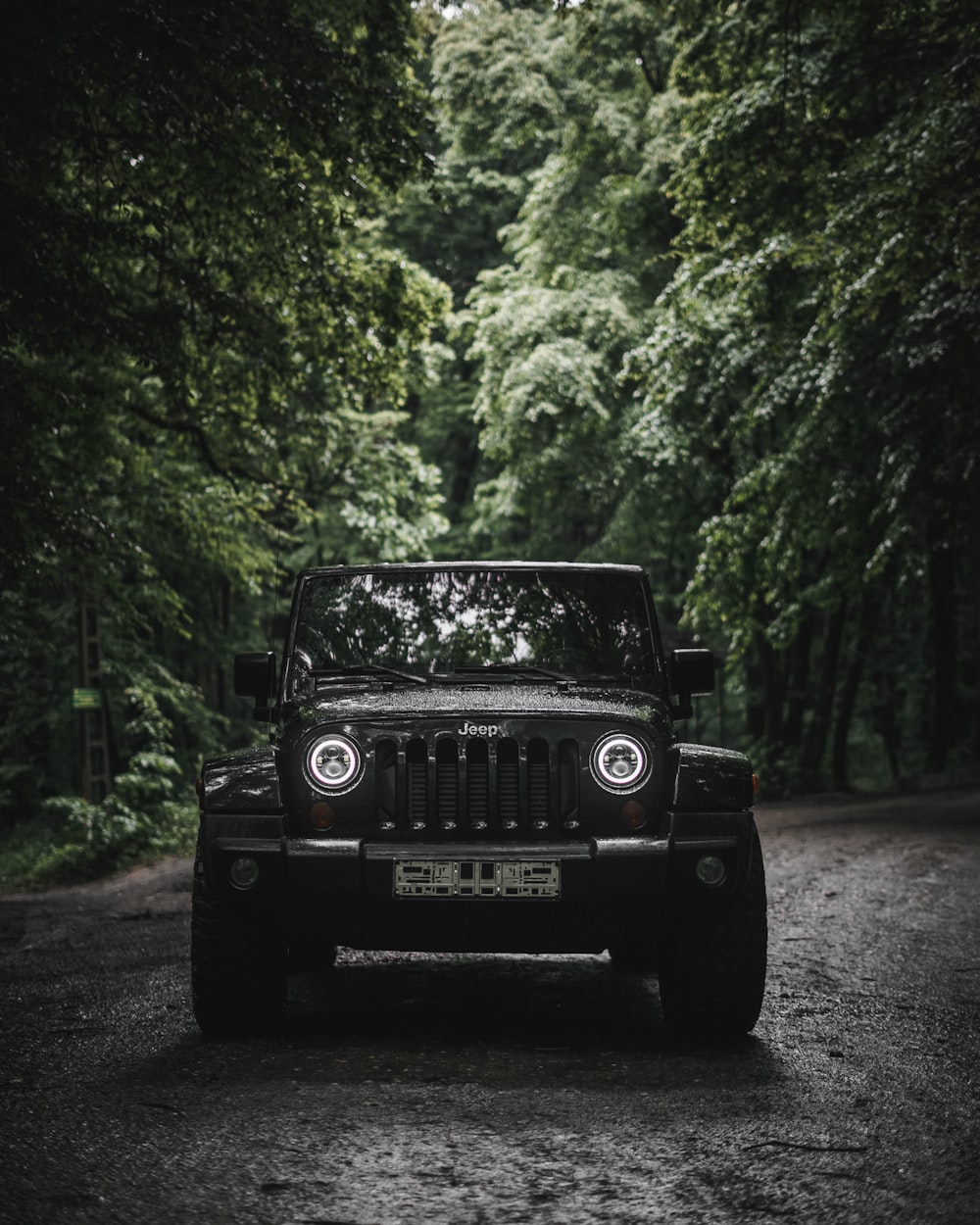 a black car parked on a road