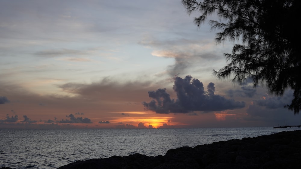 a sunset over a body of water