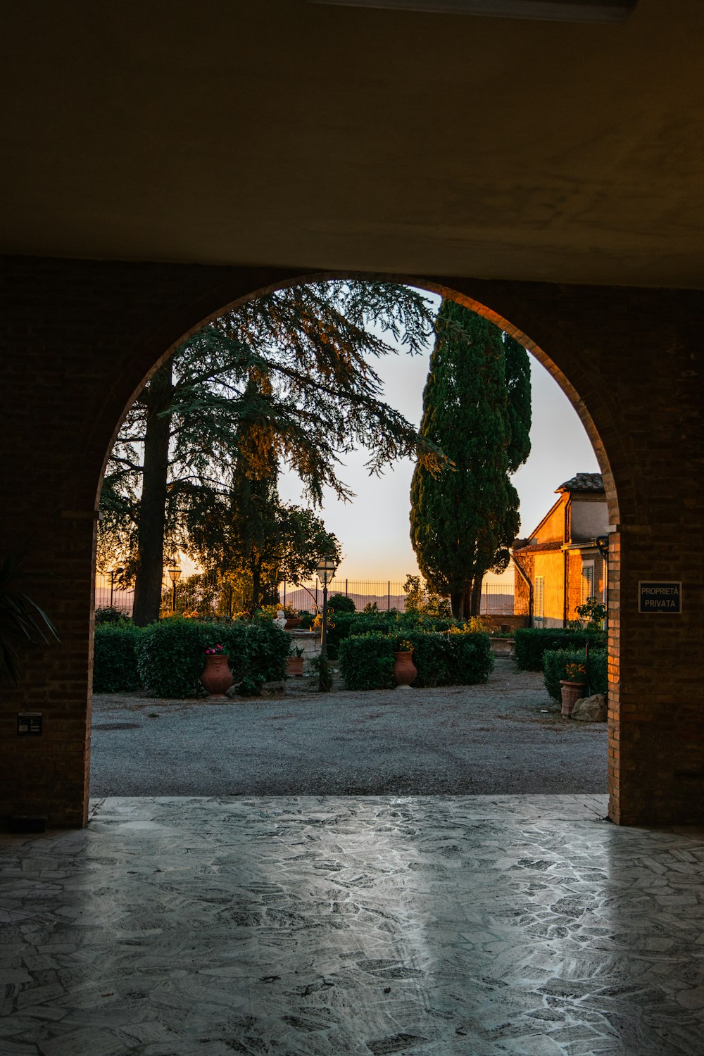 a courtyard with trees and buildings