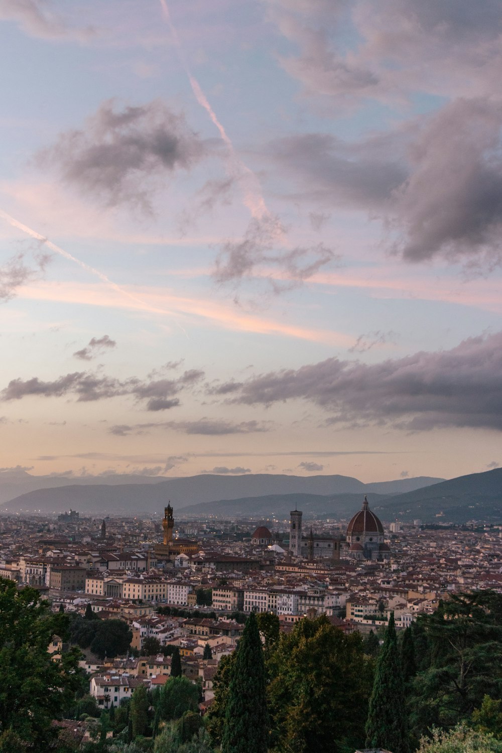 a city with a rainbow in the sky