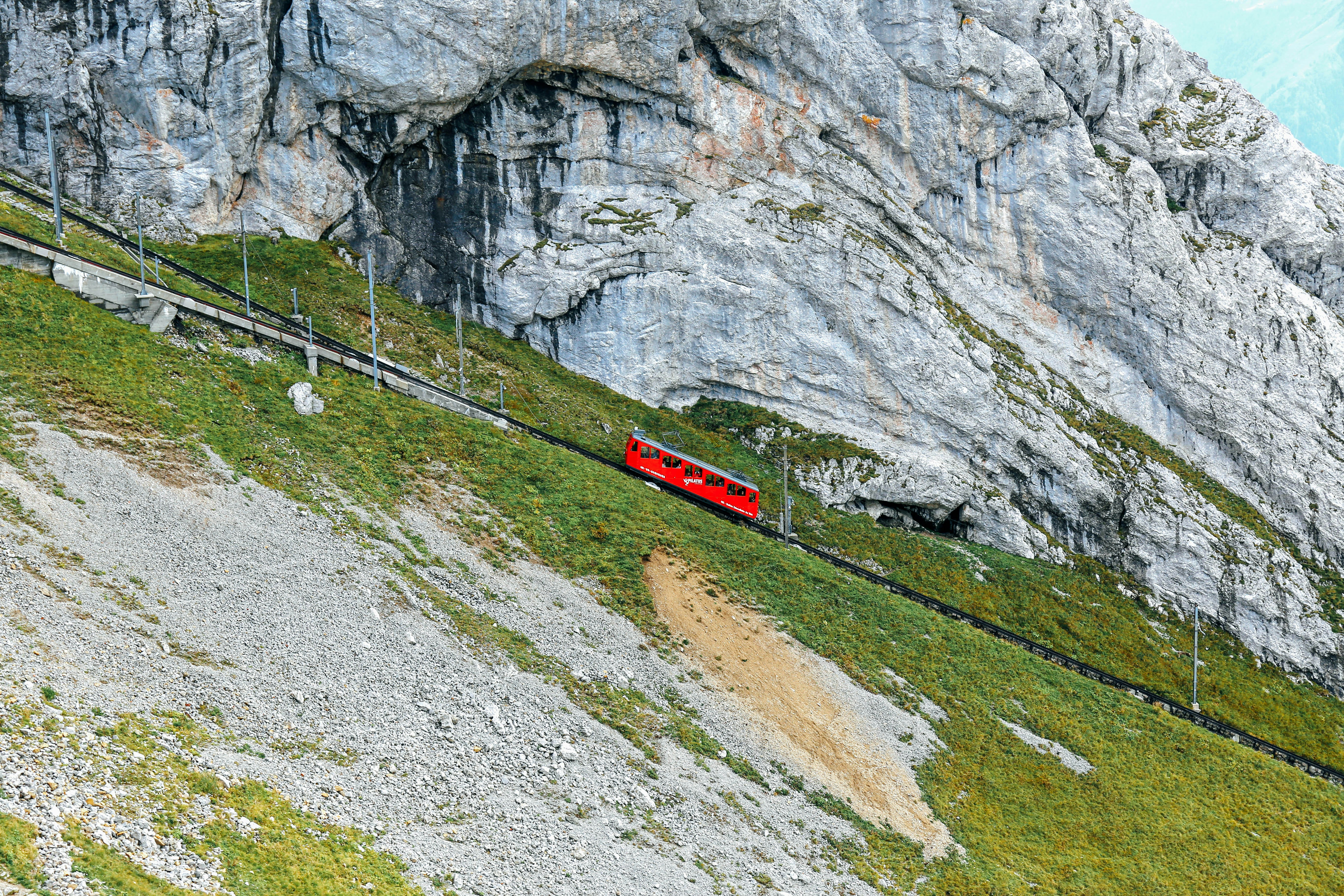 A red train on a track photo – Free Outdoors Image on Unsplash