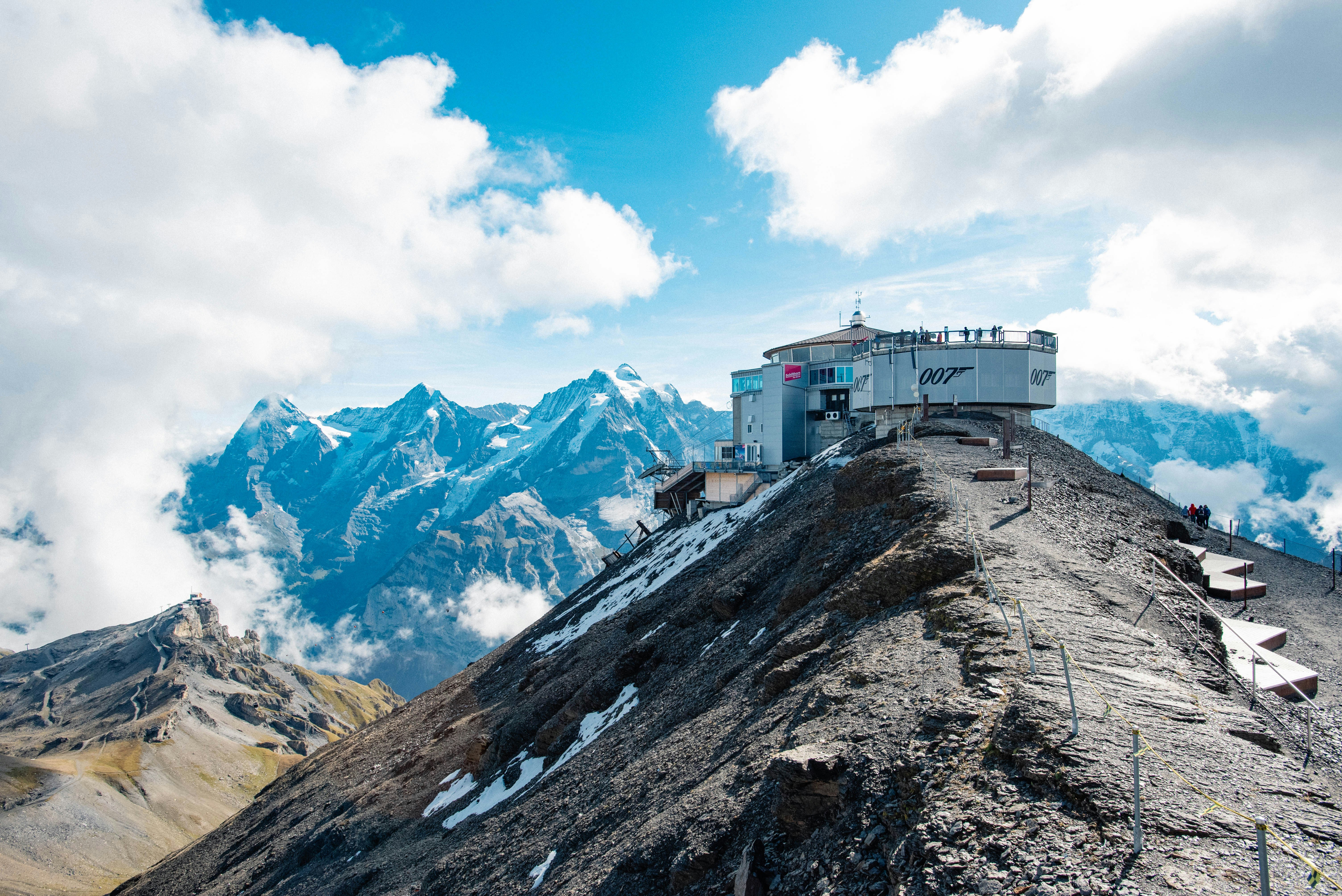 A building on a mountain photo – Free Blue Image on Unsplash