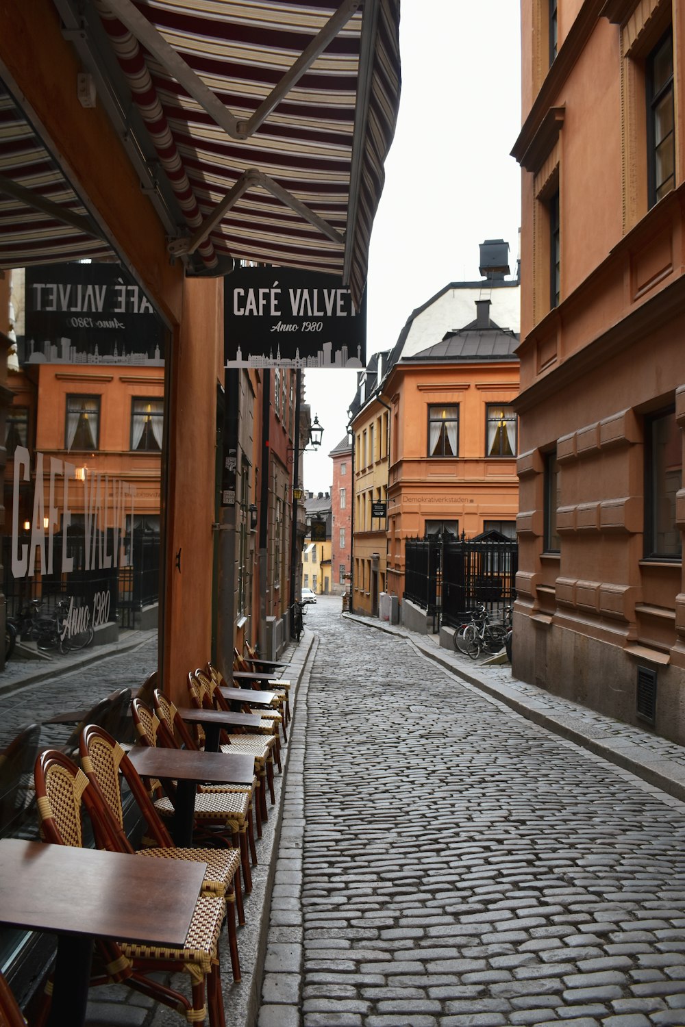 a brick walkway between buildings