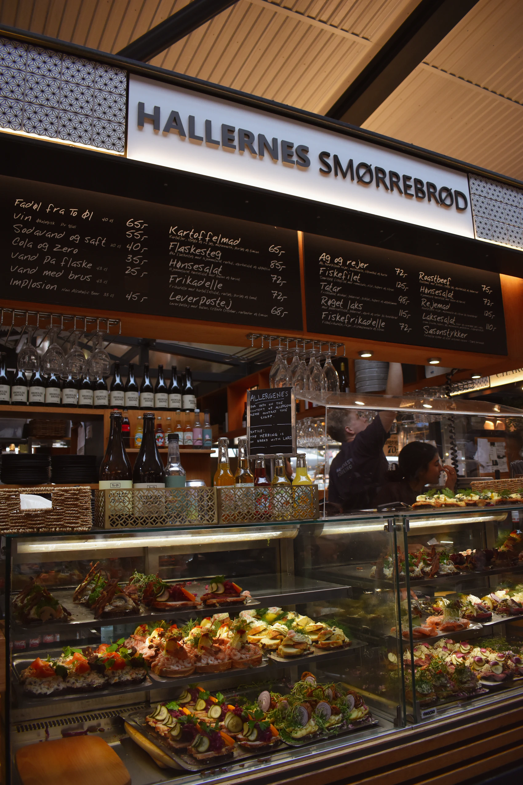 Open sandwiches and seasonal food displayed at a Copenhagen market counter