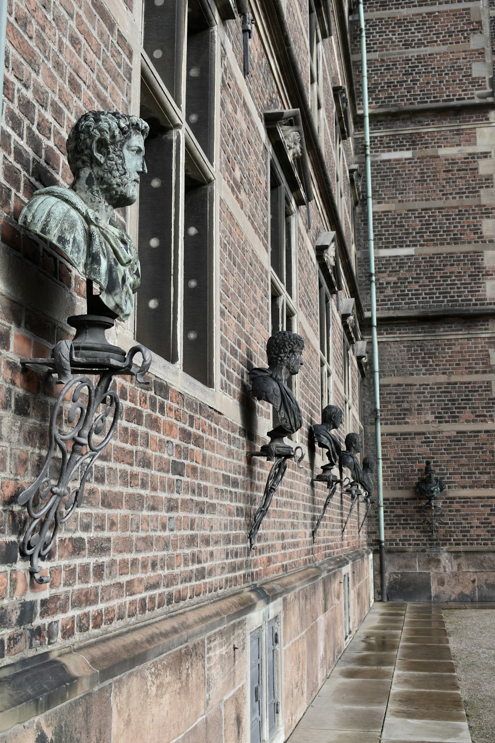 a brick building with statues