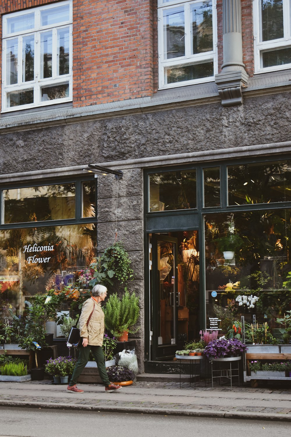 a person walking in front of a store