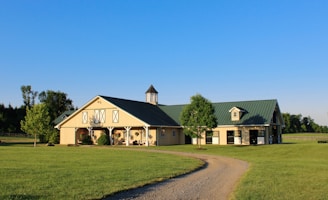 a large house with a green lawn