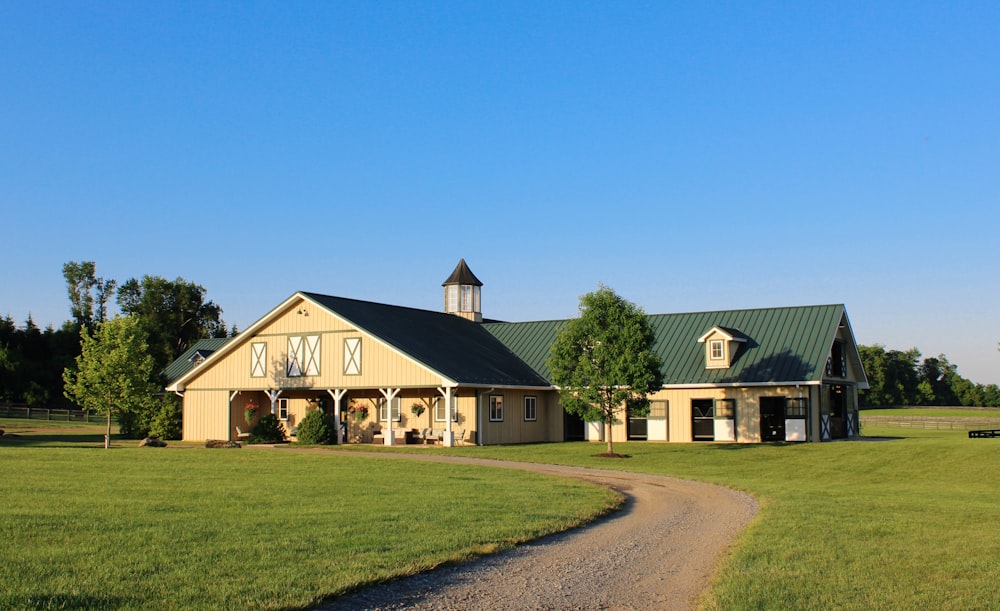 a large house with a green lawn