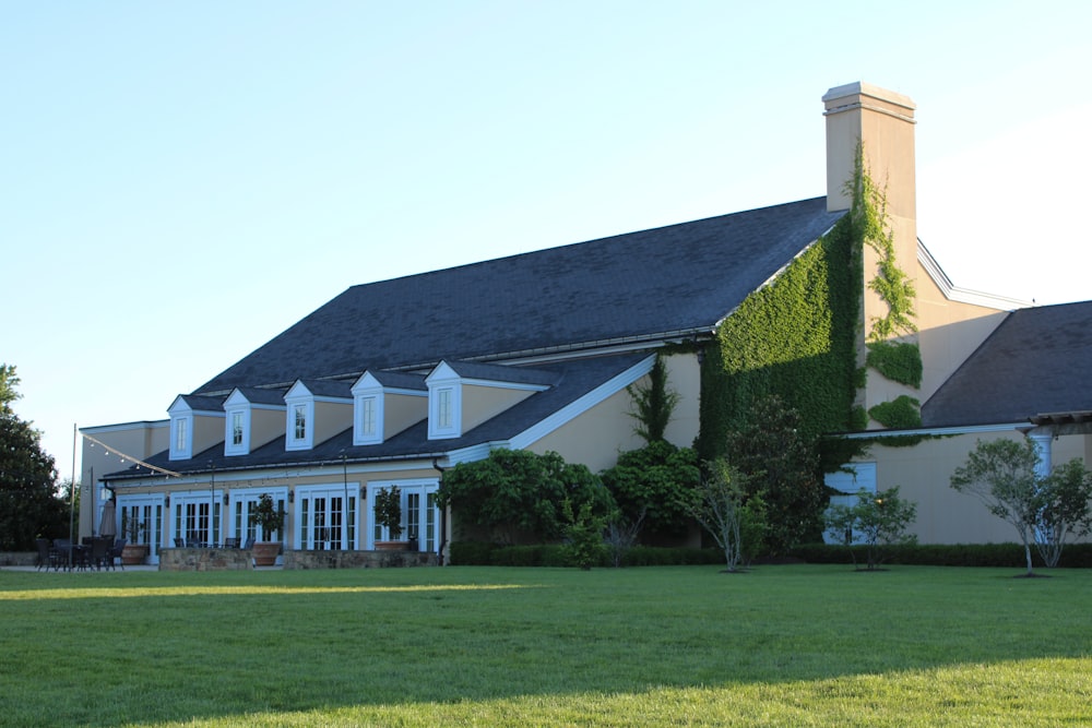 a large house with a green lawn