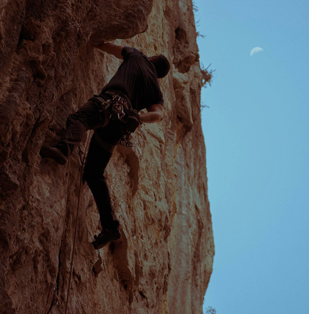 a man climbing a rock
