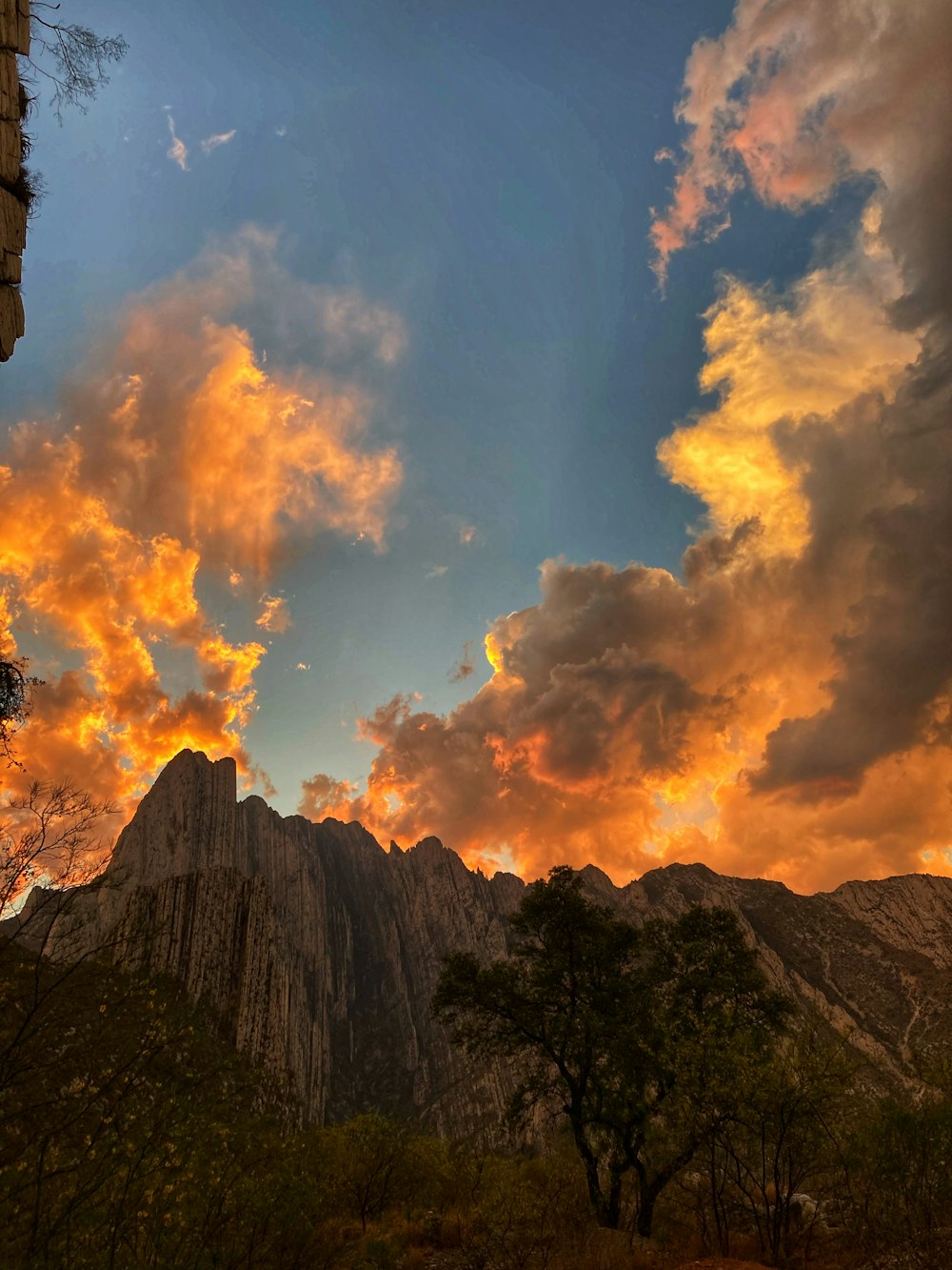 a mountain with clouds