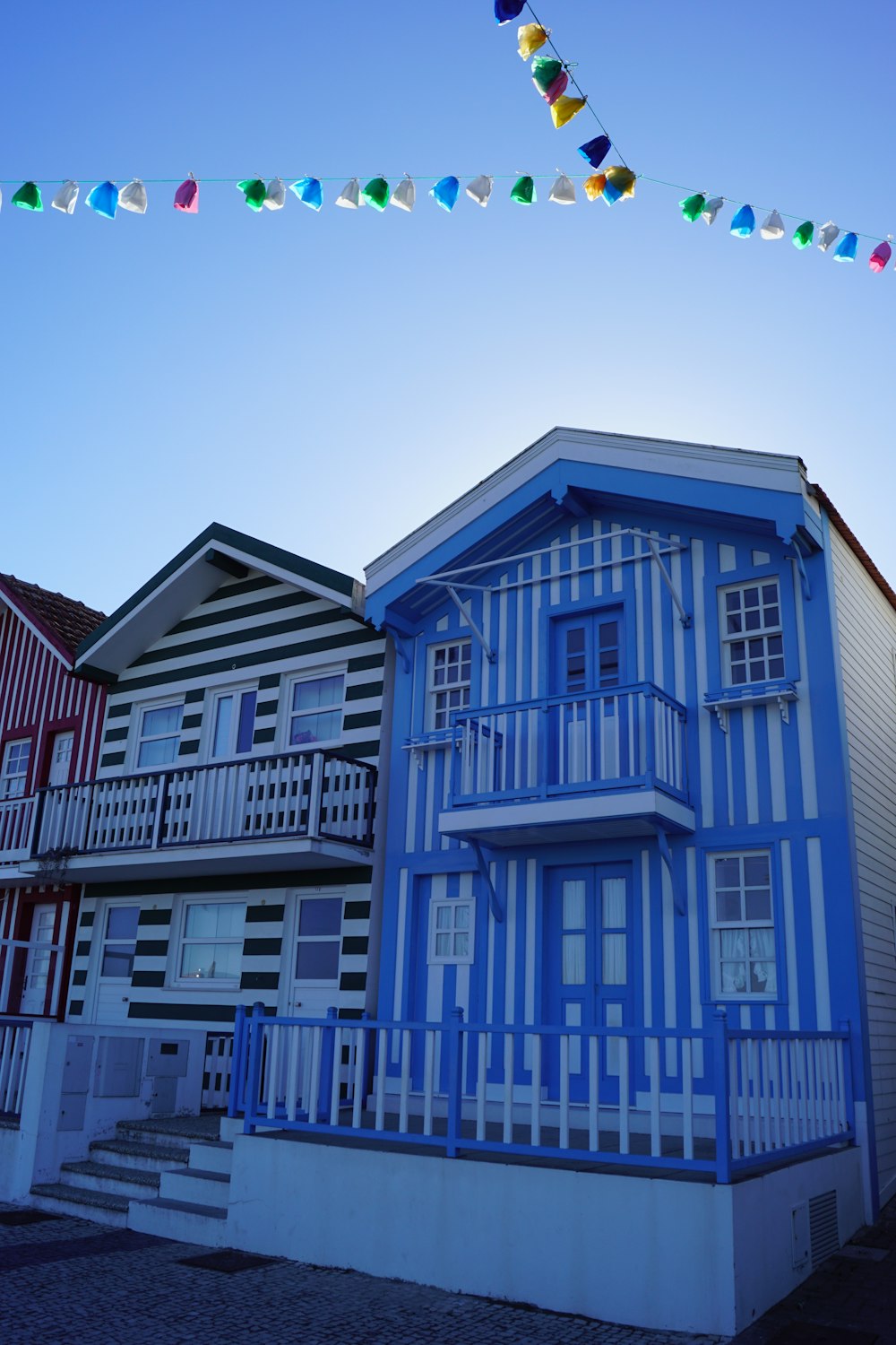 a row of houses with flags