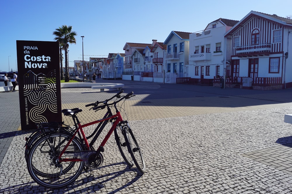 a bicycle parked on a brick road