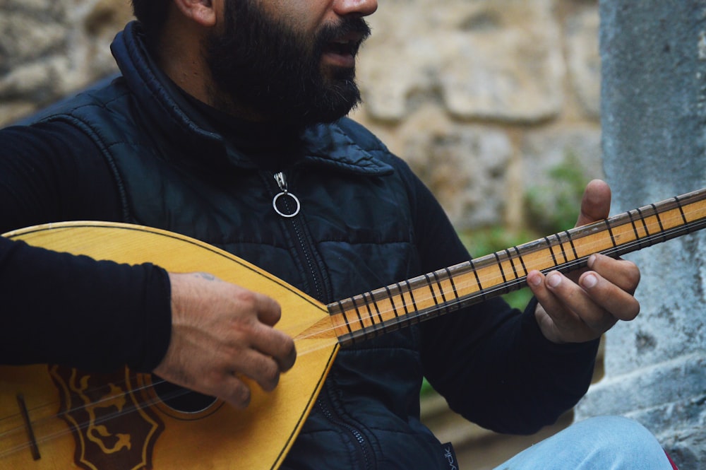 a man playing a guitar