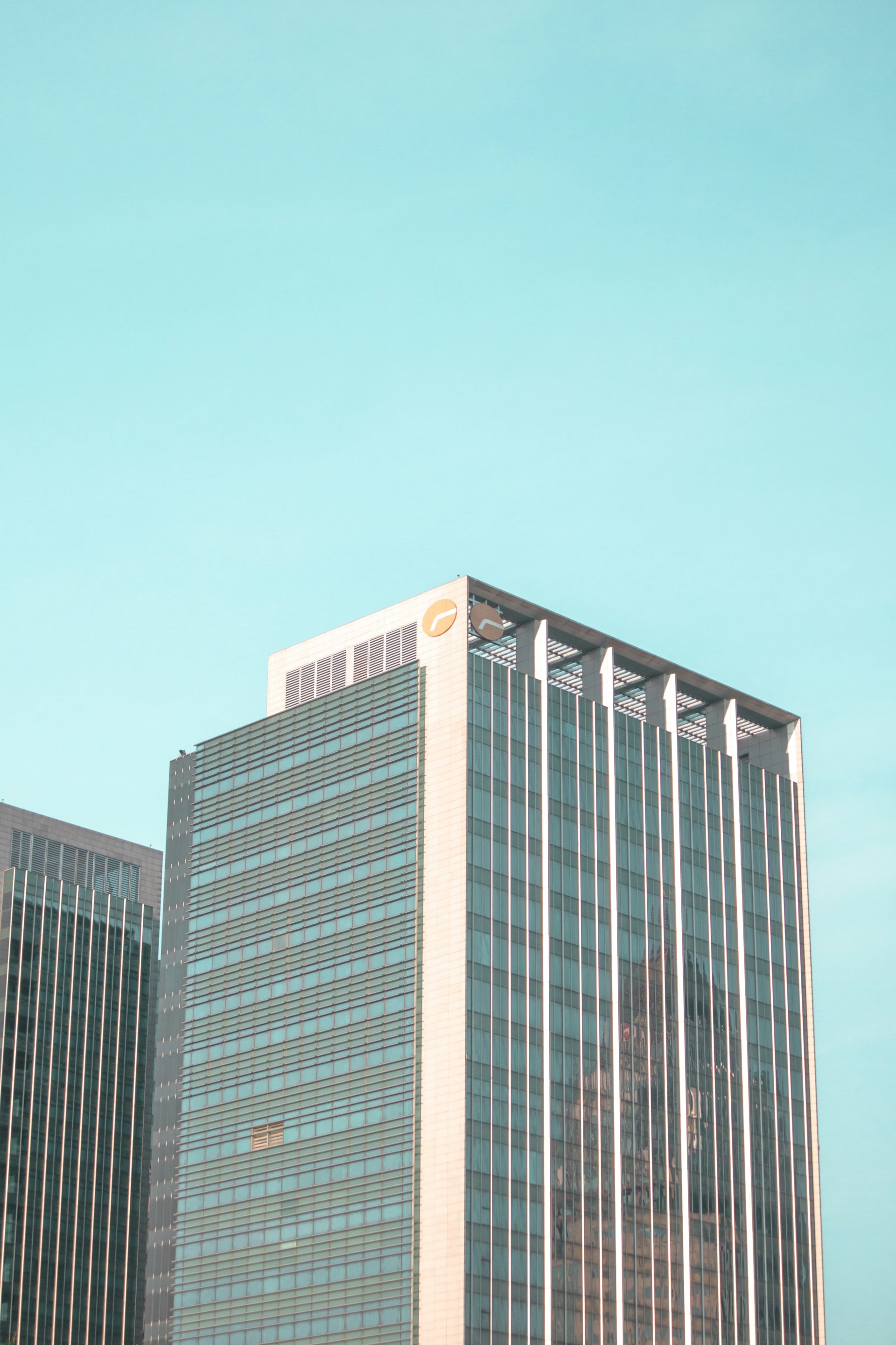 a tall building with a blue sky