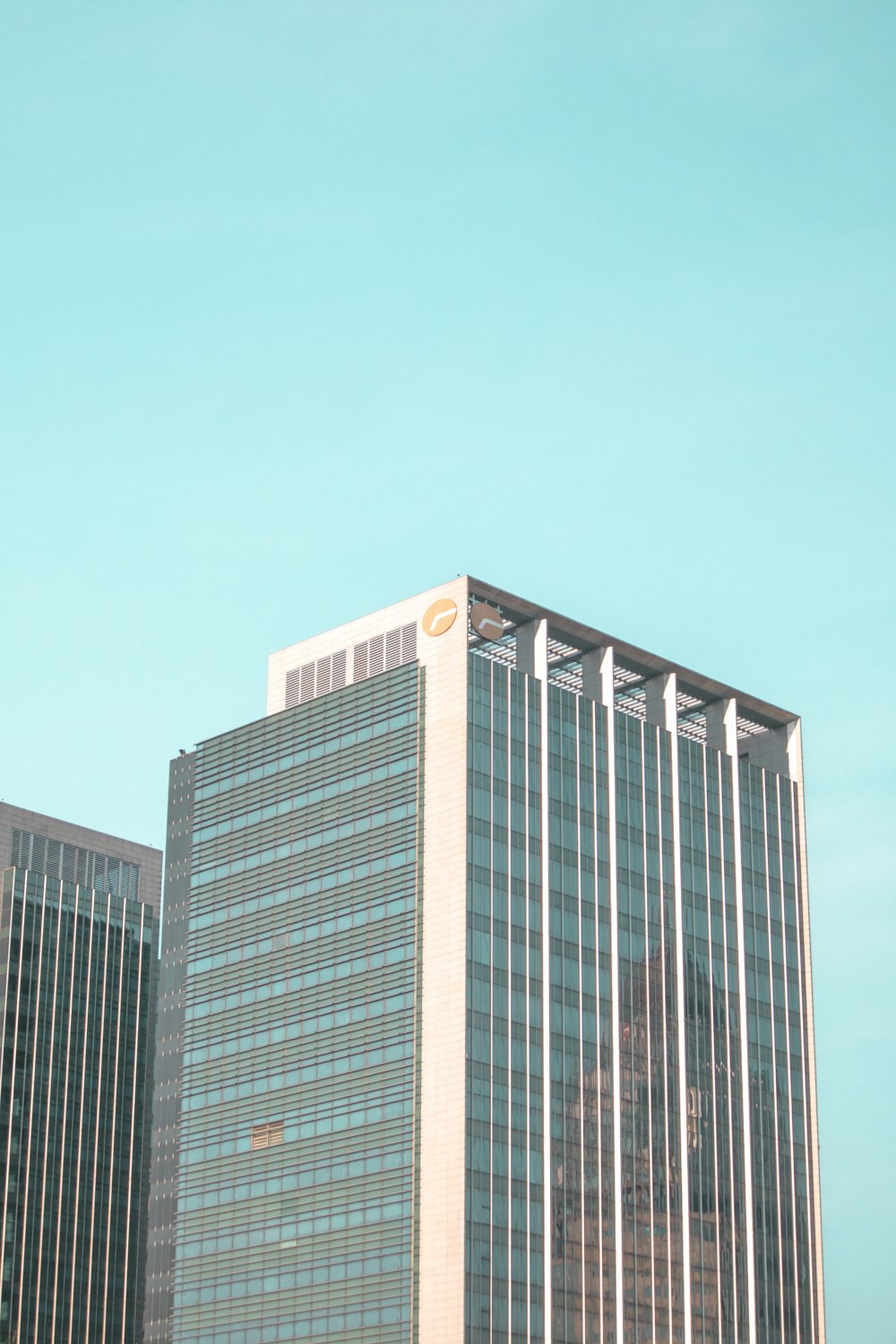 a tall building with a blue sky