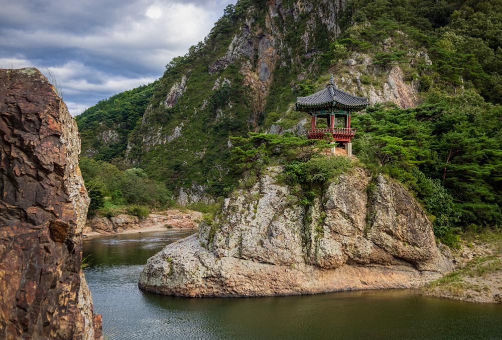 a building on a rock in the water