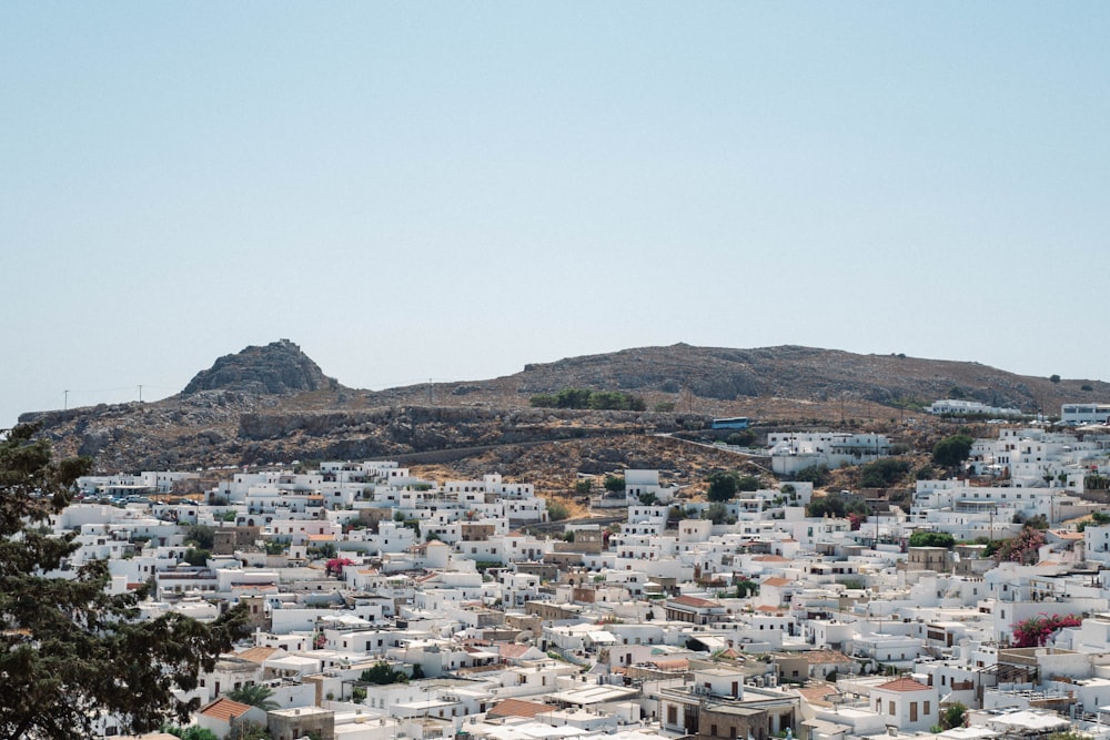 a city with a hill in the background