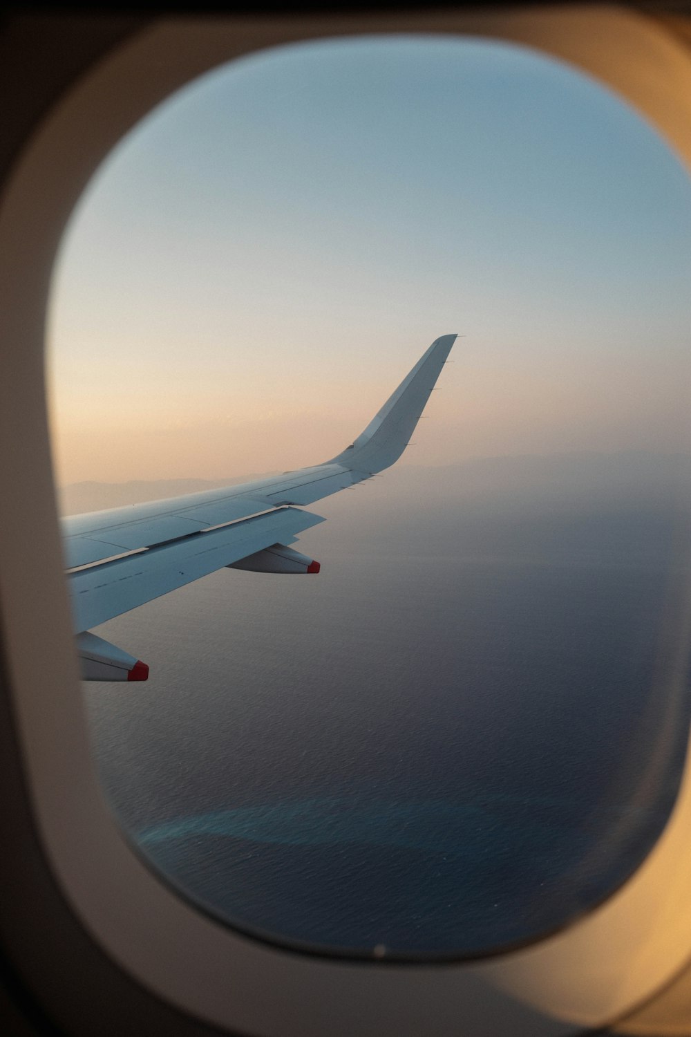 an airplane wing in the sky