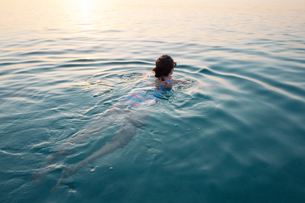 a person swimming in the water