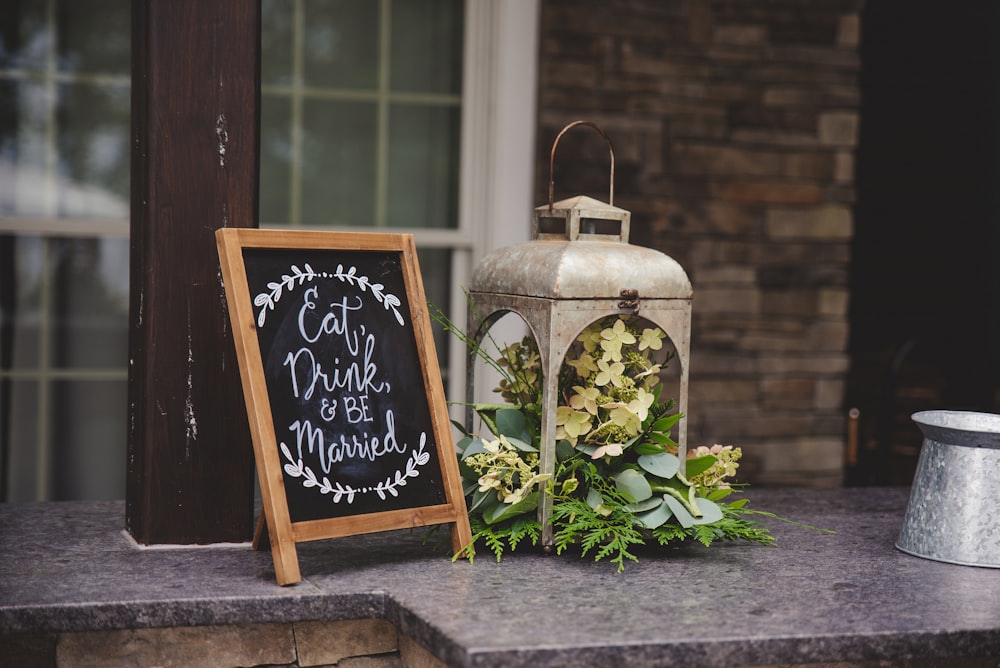 a sign next to a vase