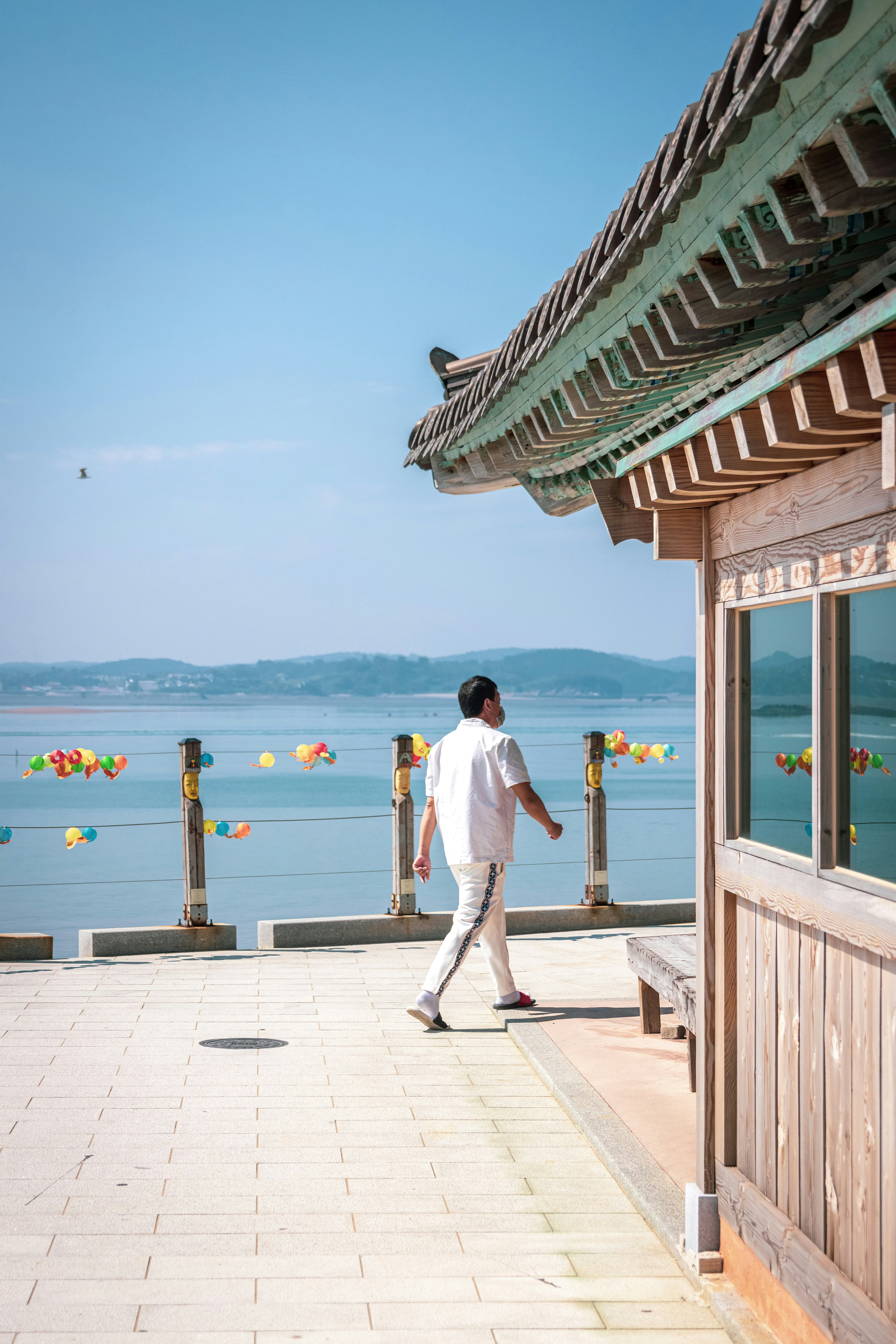 a man walking on a stone walkway