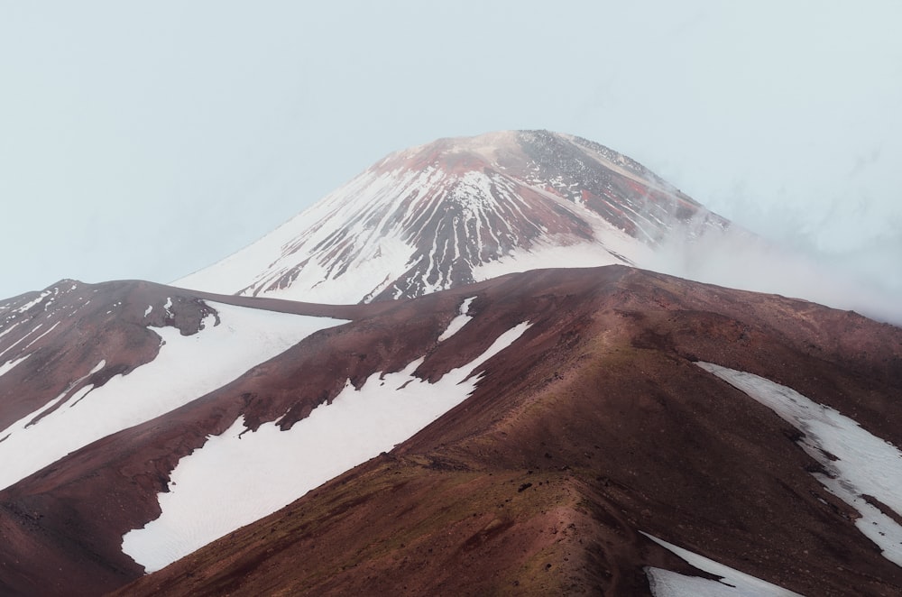 a snowy mountain with a road