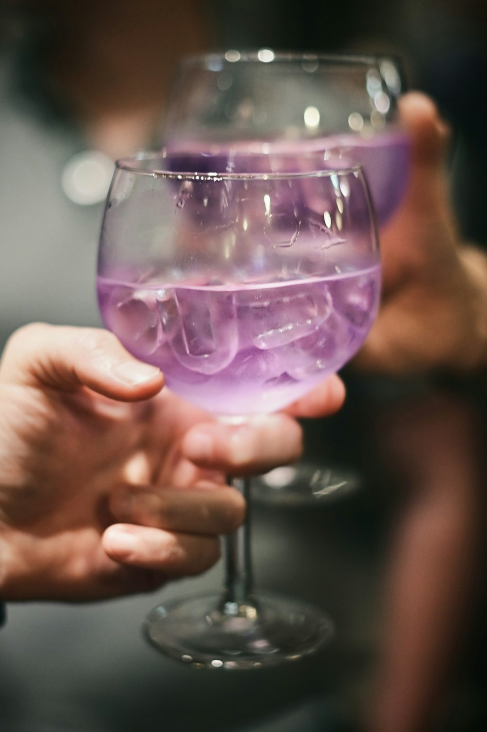 a person holding a glass of wine