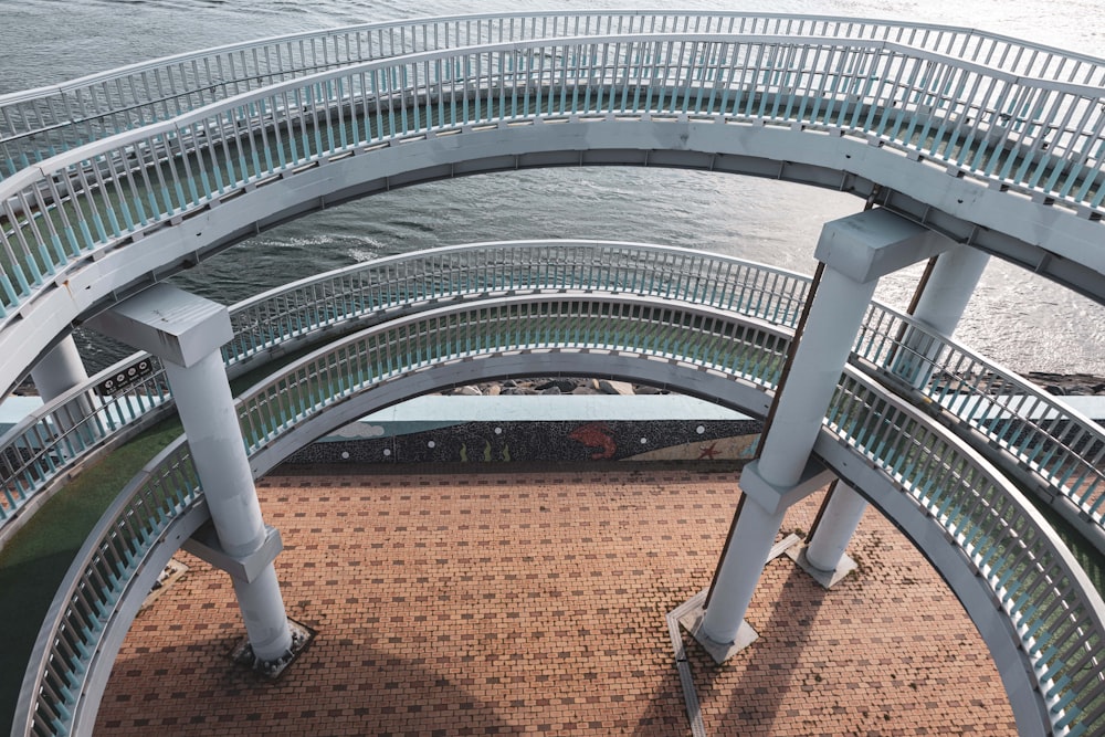 a large circular building with a brick walkway