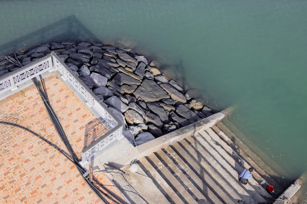 a dock with a pile of rocks