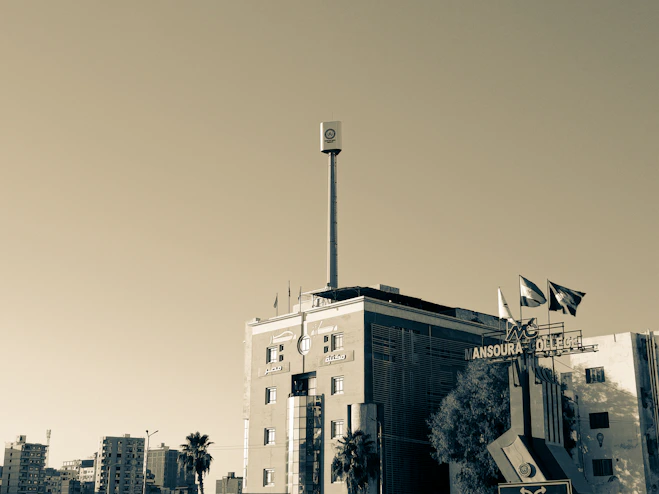 Modern office building representing the headquarters of Al-Majmoua Real Estate United in Mansoura and Fifth Settlement.