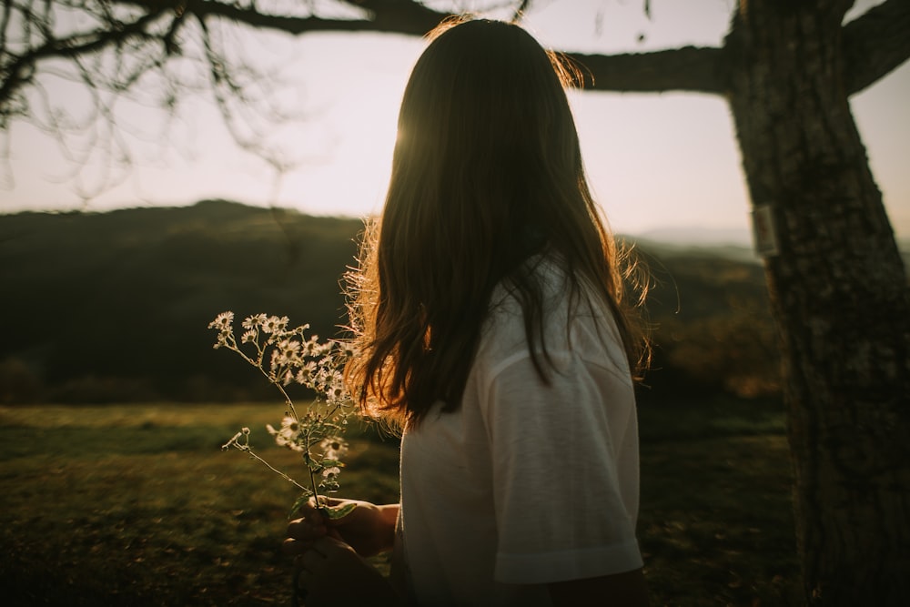 a person holding a plant