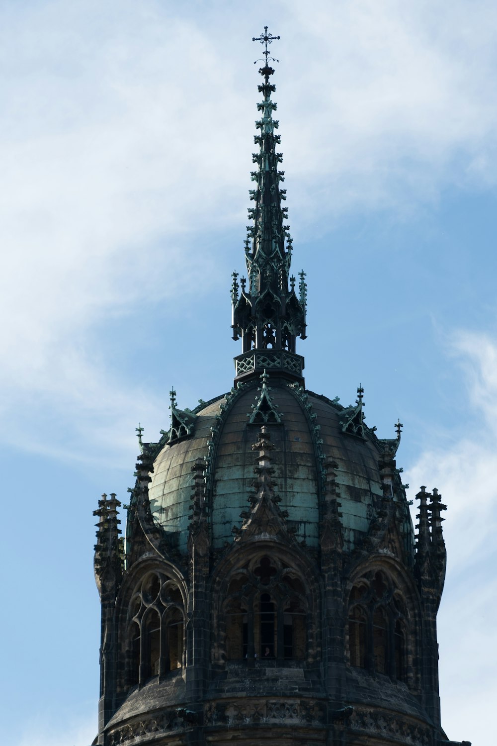 a tall building with a cross on top